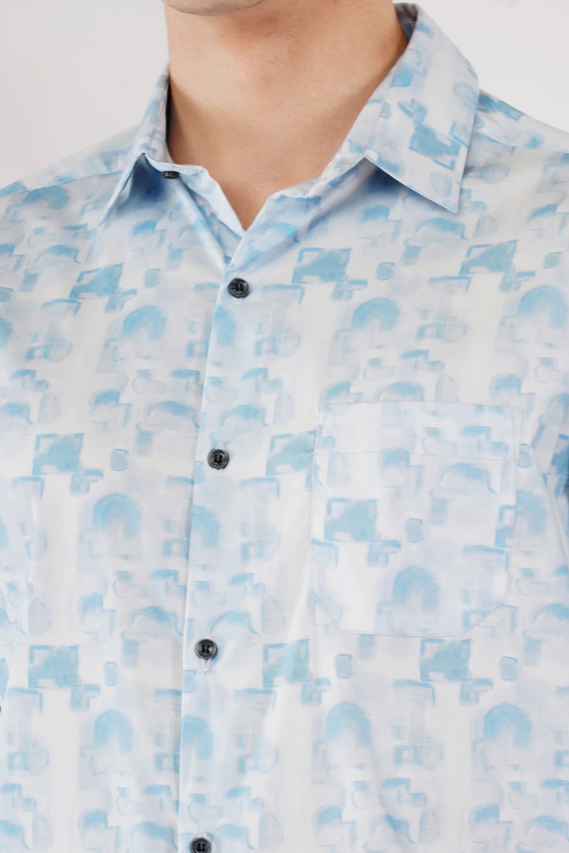 Cove slim fit men’s half sleeve shirt — sky blue printed fabric close-up